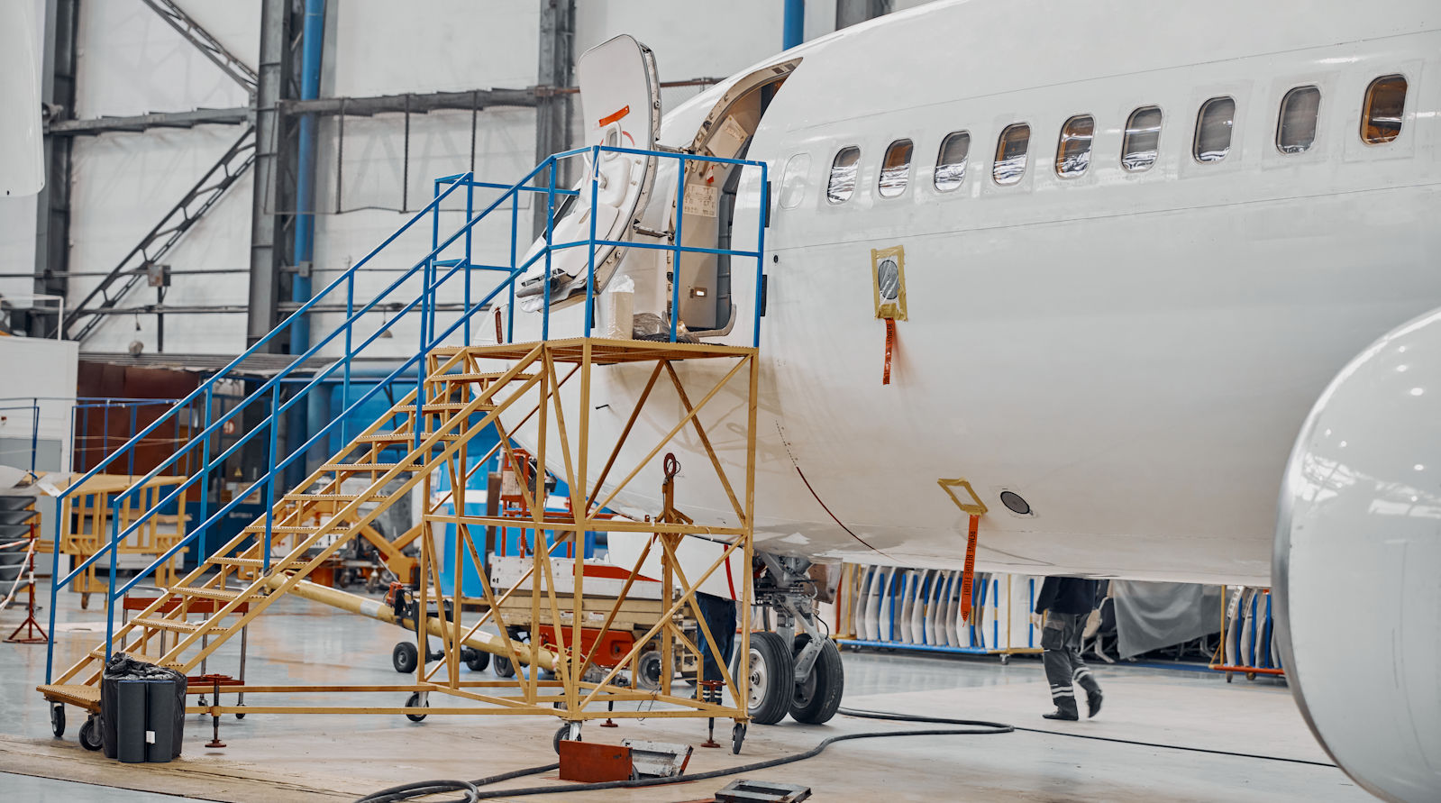 Manufacturing Design Organizations Commercial aircraft assembly inside aviation manufacturing hangar